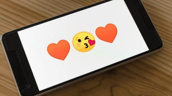 Heart and kiss emojis on phone