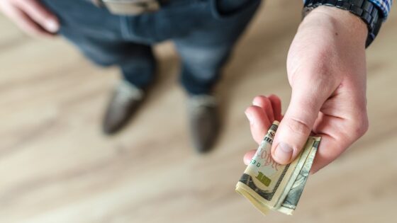 A man giving money