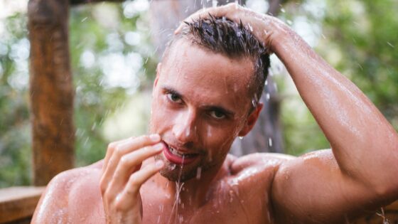 A guy taking a bath