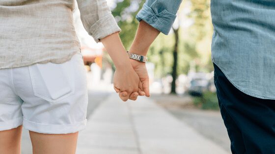 A couple holding hands