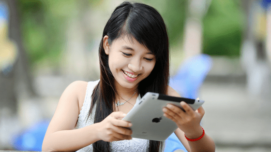 a girl chatting on her ipad